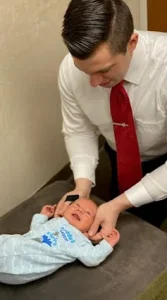 Chiropractor Concord CA Jacob Barton Adjusting Baby