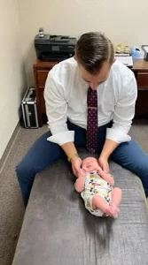 Chiropractor Concord CA Jacob Barton Adjusting Newborn